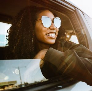 Young adults in a car having fun