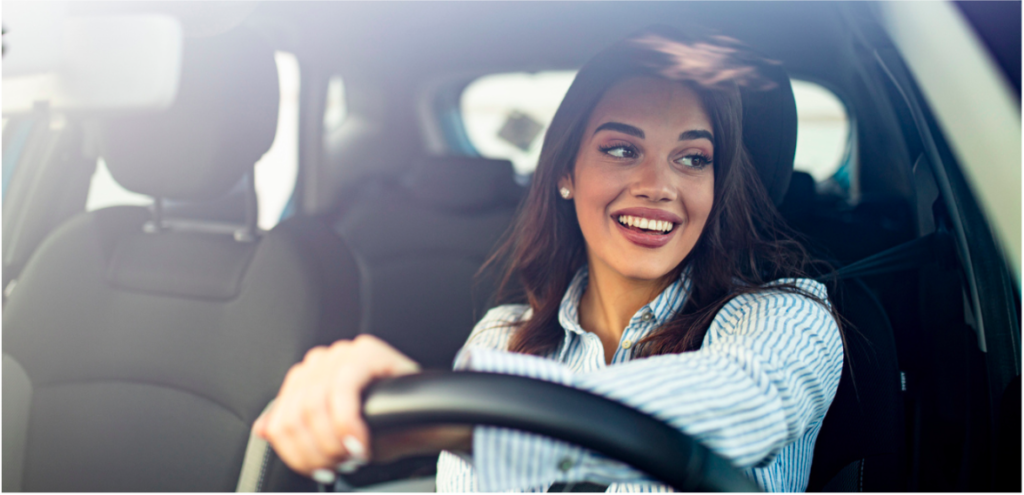 Photo of Woman Driving and Smiling