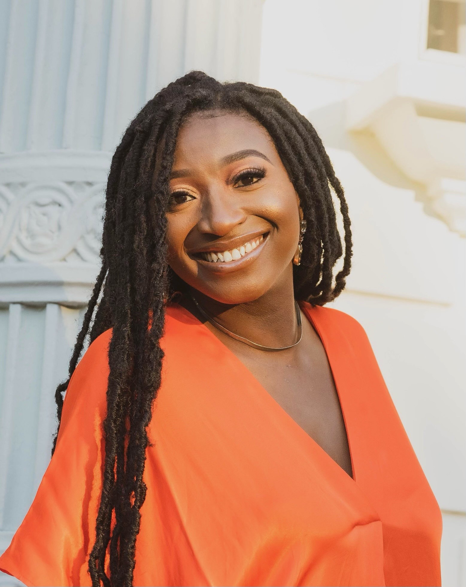 Portrait of Dr. Beverly Ibeh smiling outside