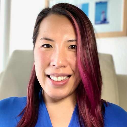 Dr. Arianne Tang smiling in her office chair